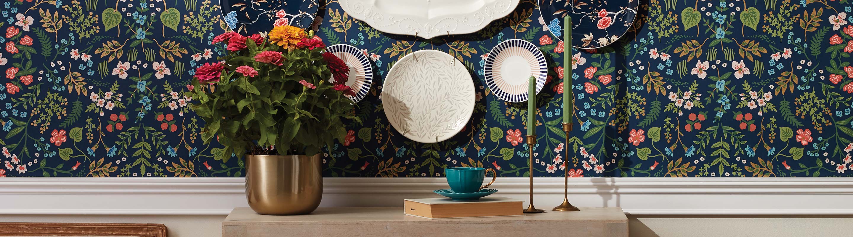 Floral wallpaper with Lenox dishes hanging on the wall