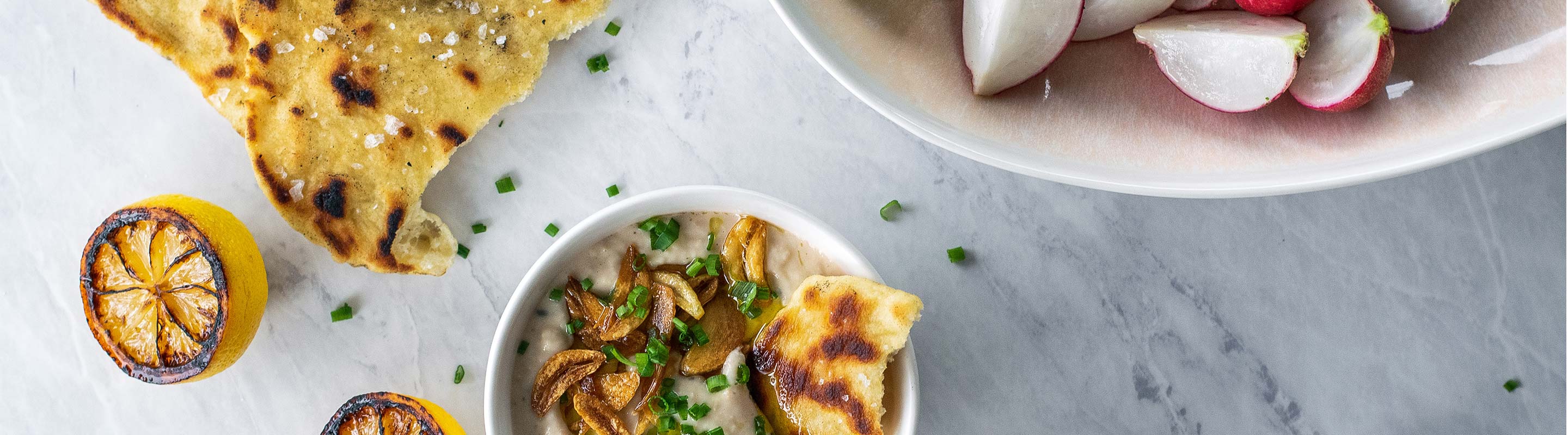 Charred Lemon White Bean Dip with Garlic Flatbread