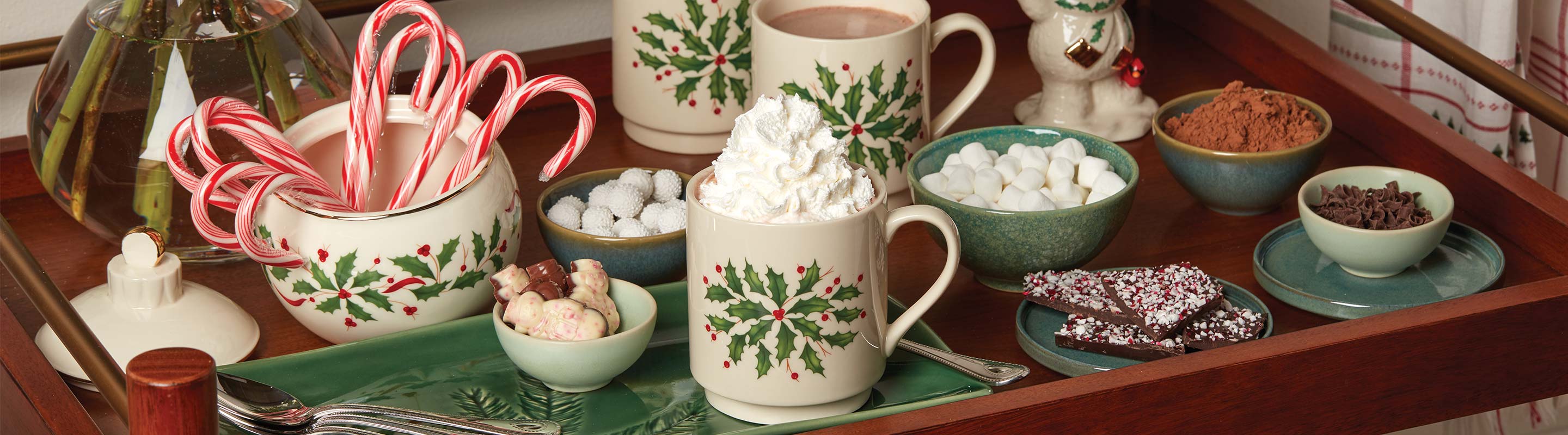 Hot cocoa bar featuring Lenox Holiday mugs and serveware