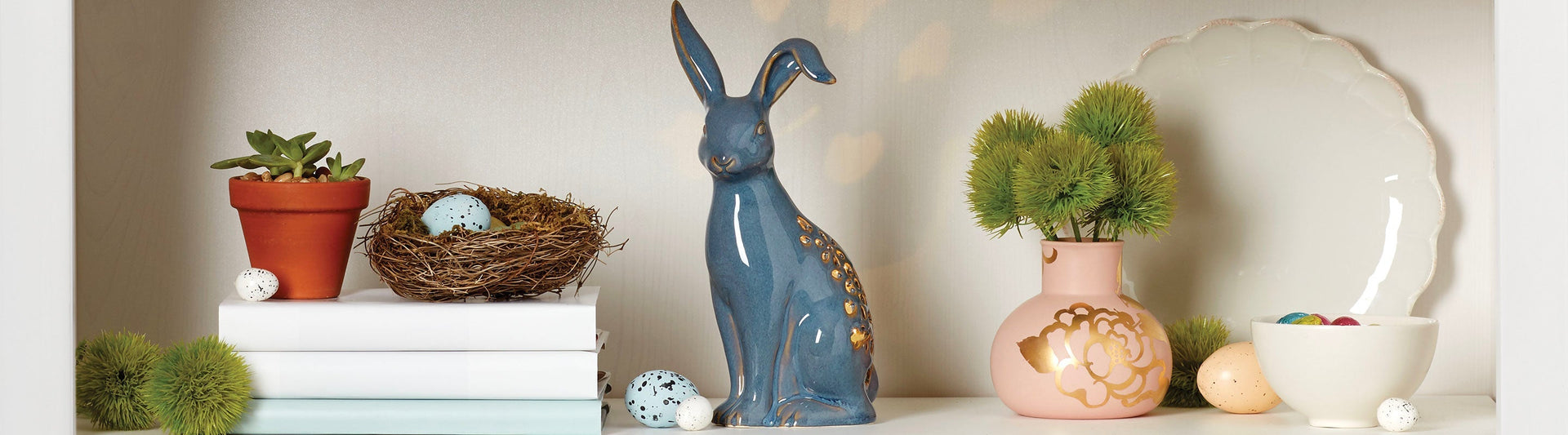 Shelf with bunny figurine, and posy vase.