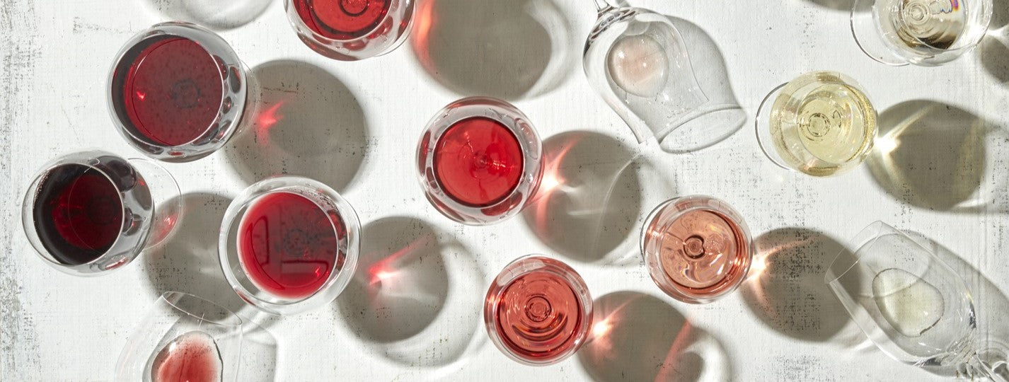 Various wine glasses on white table