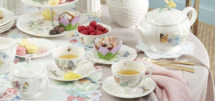 Elegant tea set with floral butterfly patterns