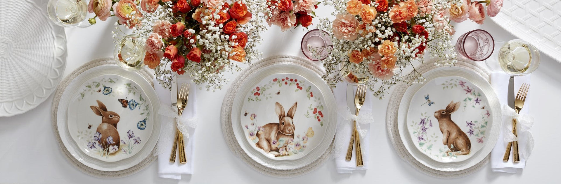 Easter table setting with bunny plates and flowers