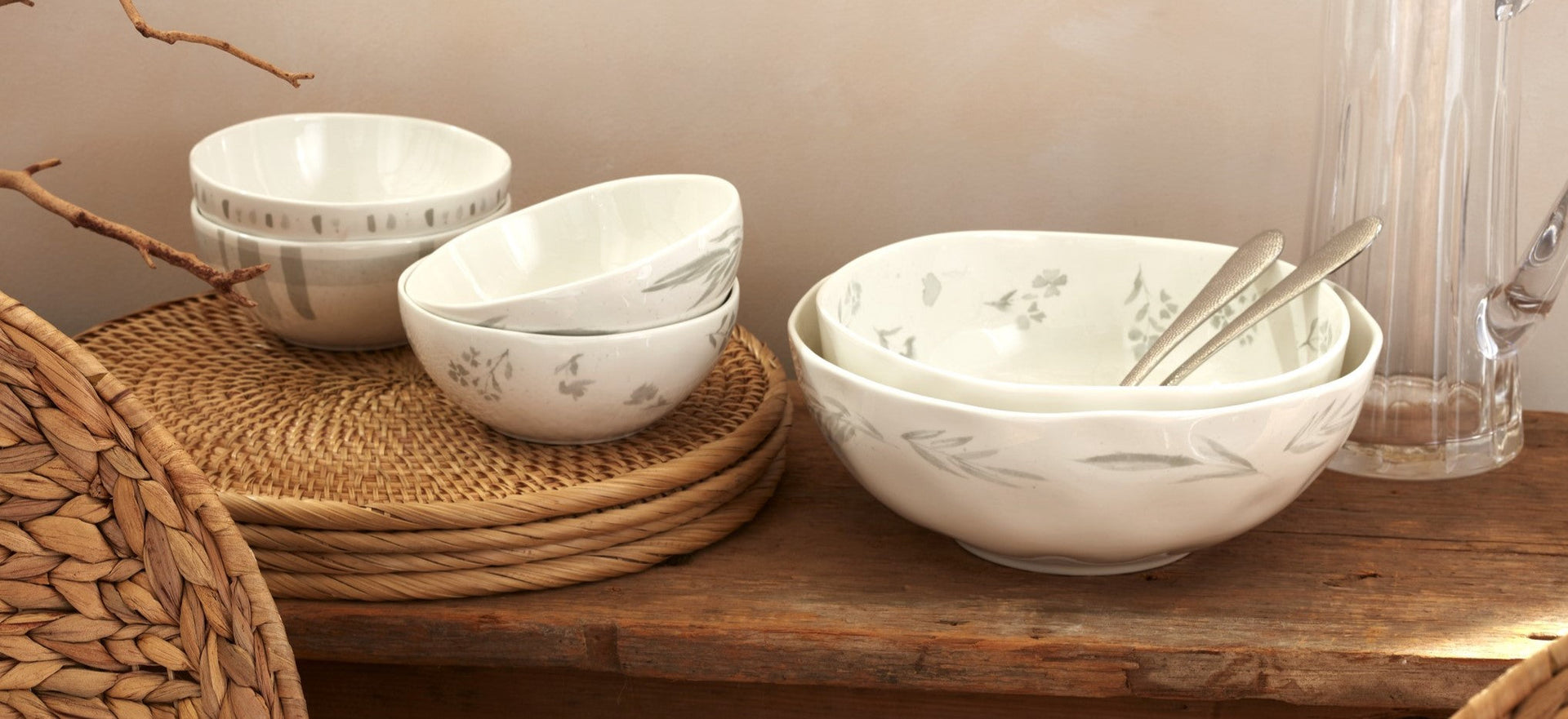 Stacked white ceramic bowls with gray patterns.