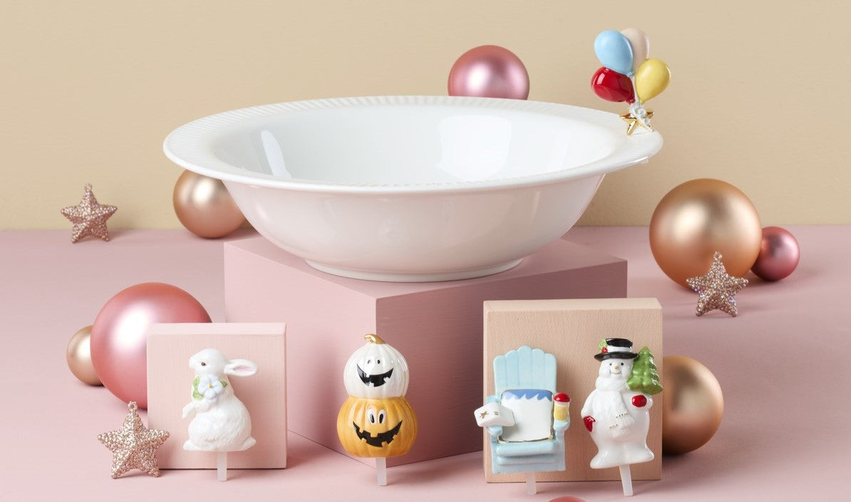 White bowl with seasonal ceramic figurines