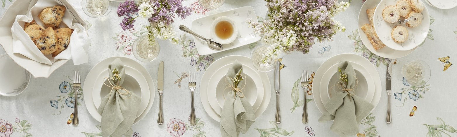 Elegant spring table setting with floral linens.