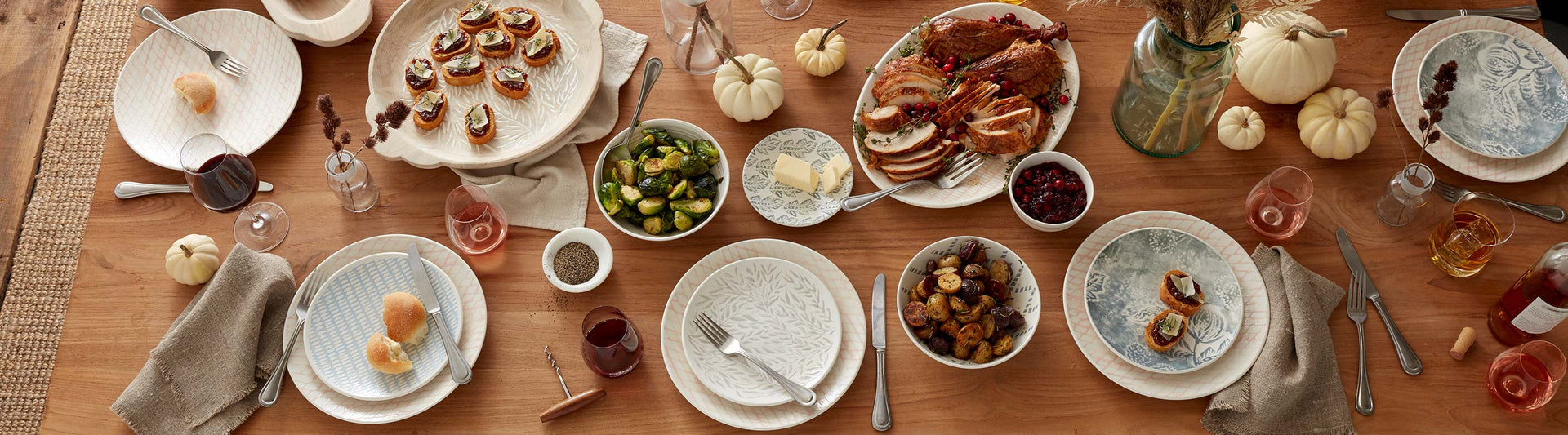 Thanksgiving table with food and white dishes