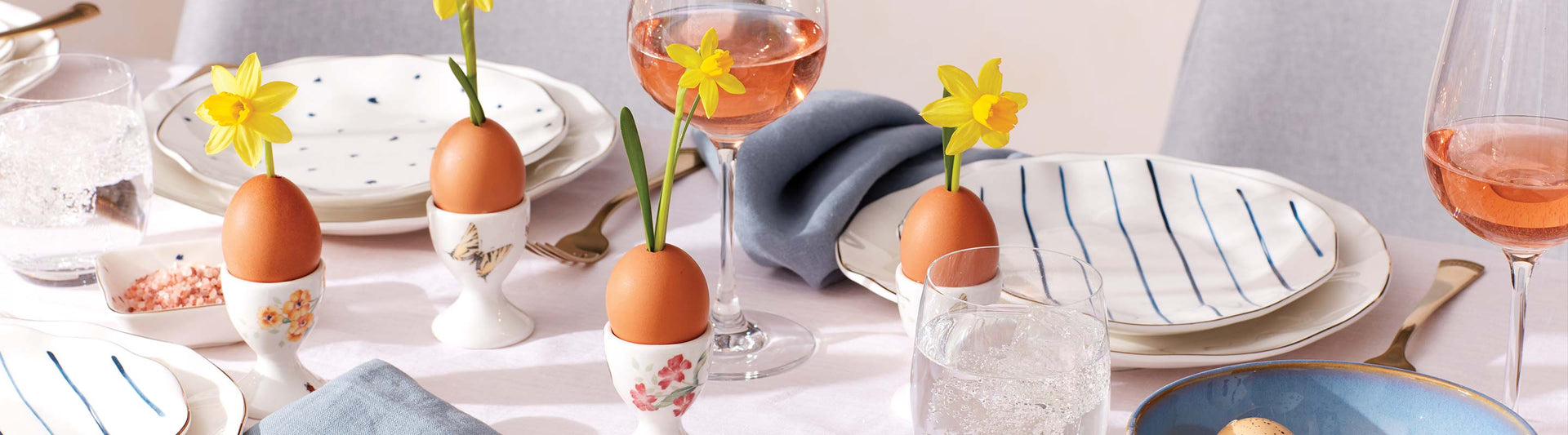 Butterfly Meadow Egg Cups with Eggs and Daffodils, on a table with Blue Bay Dishes