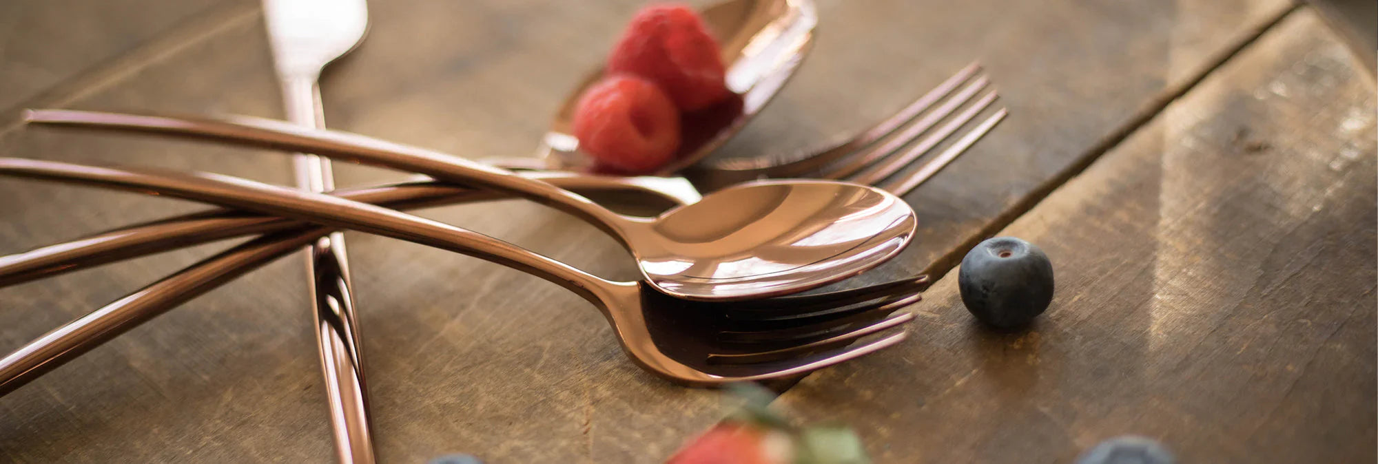 rose gold flatware with berries